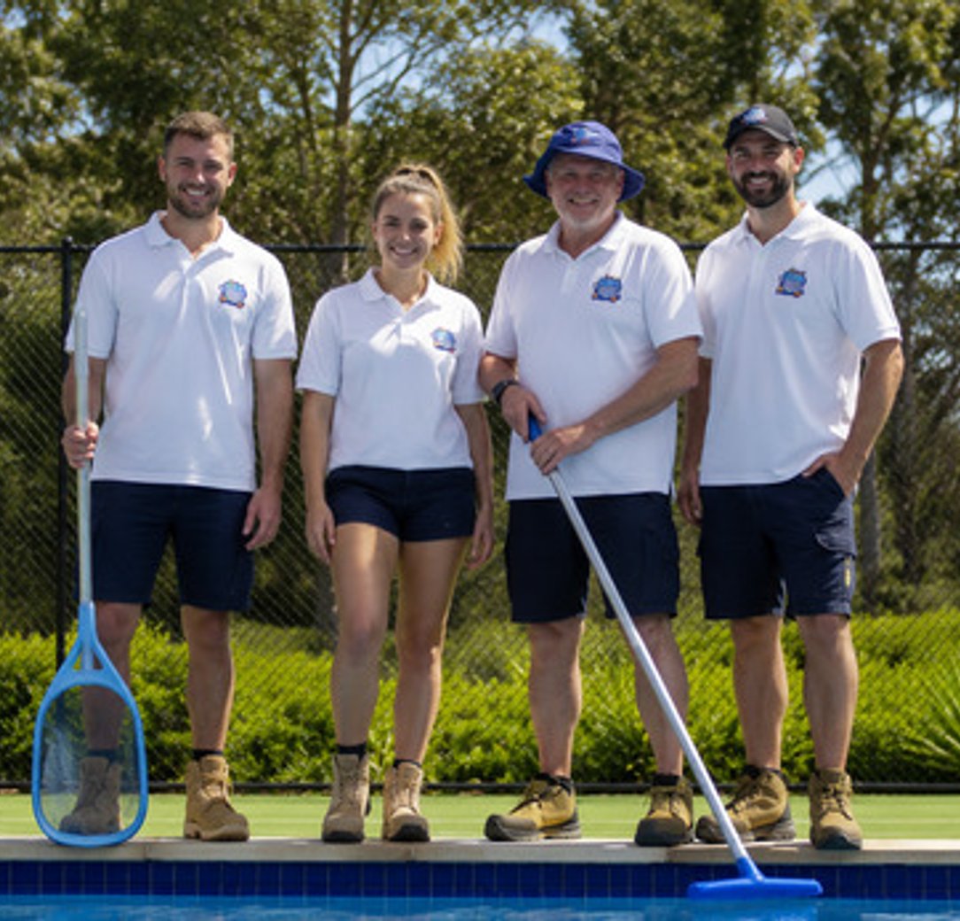 Pool cleaning team servicing a residential pool